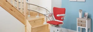 Lady using a curved stairlift for safe stair access in a Bristol home