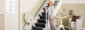Lady using a stairlift in a Bristol home for safe stair access