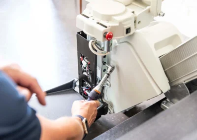 Stannah stairlift engineer inspecting control panel in a Somerset home