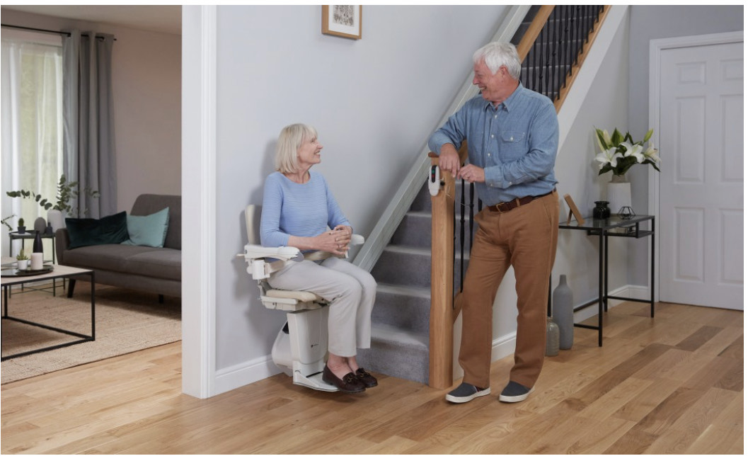Handicare stairlift installation with elderly couple in Gloucester home